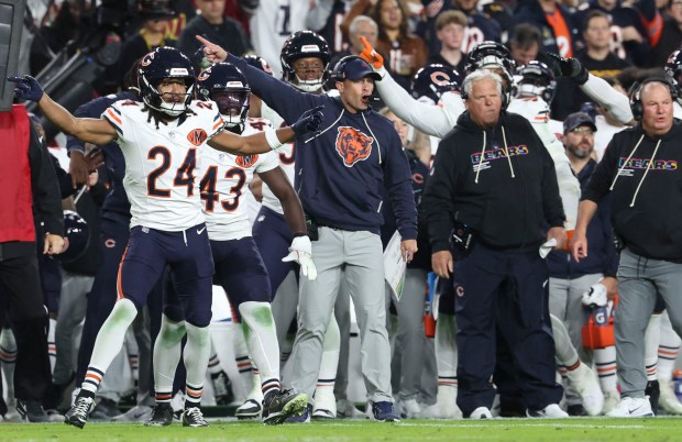 Chicago Bears head coach Ben Johnson and his sideline celebrate...