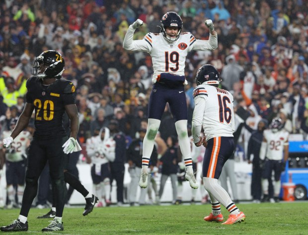 Chicago Bears holder Tory Taylor (19) jumps to celebrate a...