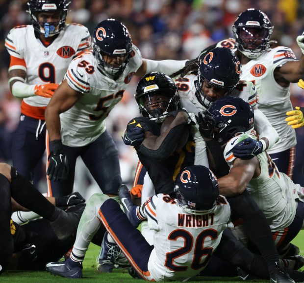 The Chicago Bears defence inclduing middle linebacker Tremaine Edmunds (49)...