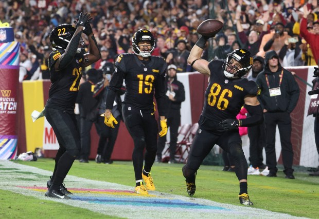 Washington Commanders tight end Zach Ertz (86) celebrates his fourth...