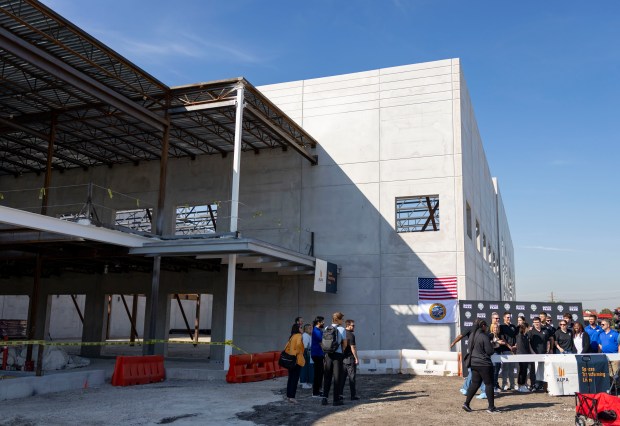 Chicago Sky and Bedford Park officials sign the final beam...