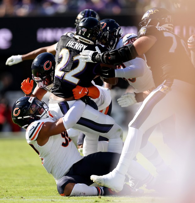 Bears defensive end Daniel Hardy tackles Ravens running back Derrick Henry in the second quarter Sunday, Oct. 26, 2025, at M&T Bank Stadium in Baltimore. (Chris Sweda/Chicago Tribune)