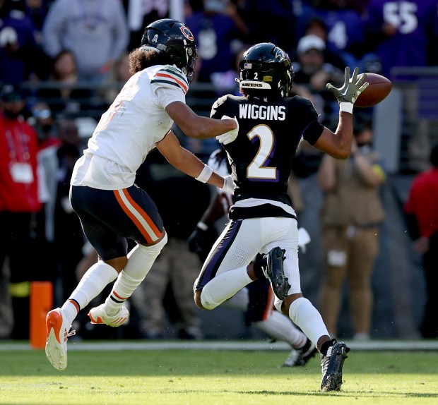 Bears wide receiver Rome Odunze is unable to stop Ravens cornerback Nate Wiggins (2) from intercepting a pass by Caleb Williams in the fourth quarter Sunday, Oct. 26, 2025, at M&T Bank Stadium in Baltimore. (Chris Sweda/Chicago Tribune)