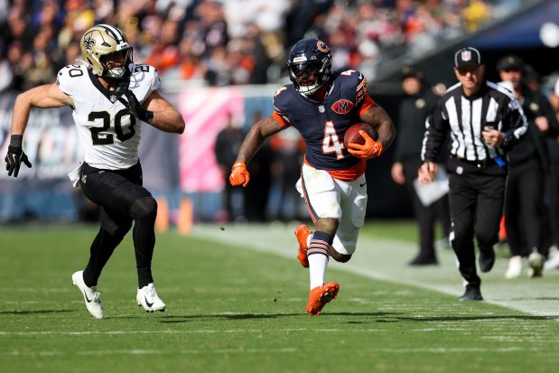 Bears running back D'Andre Swift runs for a first down during the fourth quarter against the Saints on Sunday, Oct. 19, 2025, at Soldier Field. (Armando L. Sanchez/Chicago Tribune)