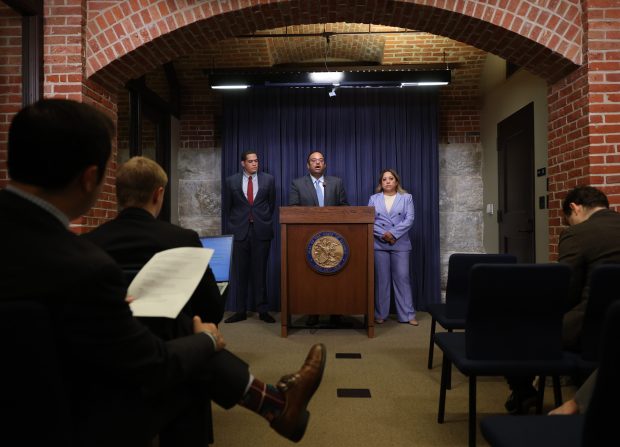 State Sen. Ram Villivalam, center, briefs reporters on transit issues at the Illinois State Capitol on May 29, 2025, in Springfield. (John J. Kim/Chicago Tribune)