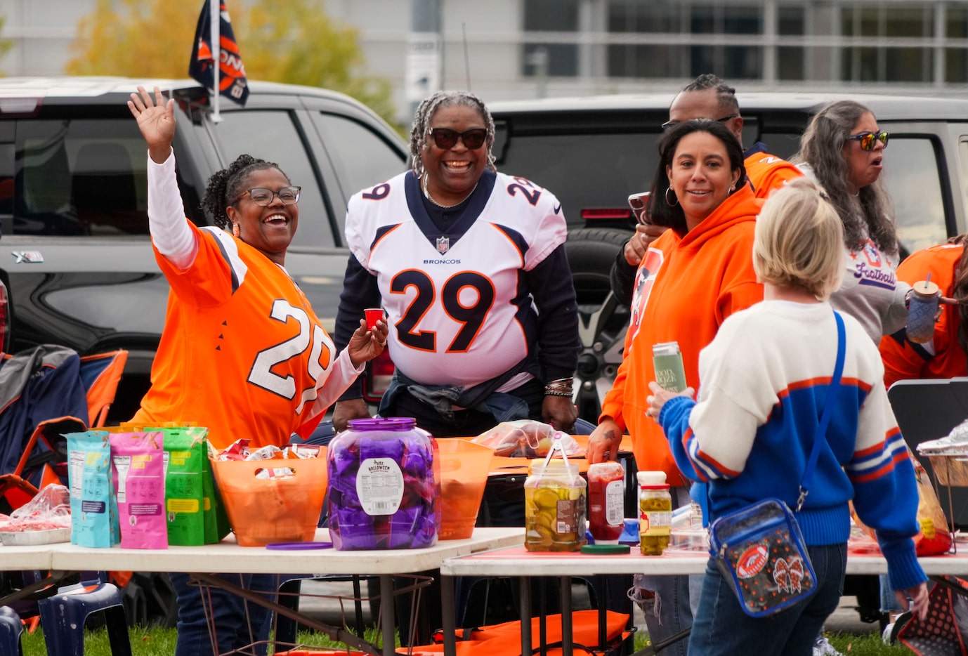 Denver Broncos fans tailgate before an NFL football game against the Dallas Cowboys at...