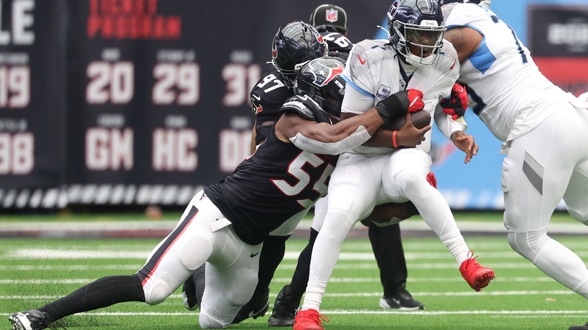 Houston Texans defensive end Danielle Hunter (55) sacks Tennessee Titans quarterback Cam Ward (1) during the first half at NRG Stadium.