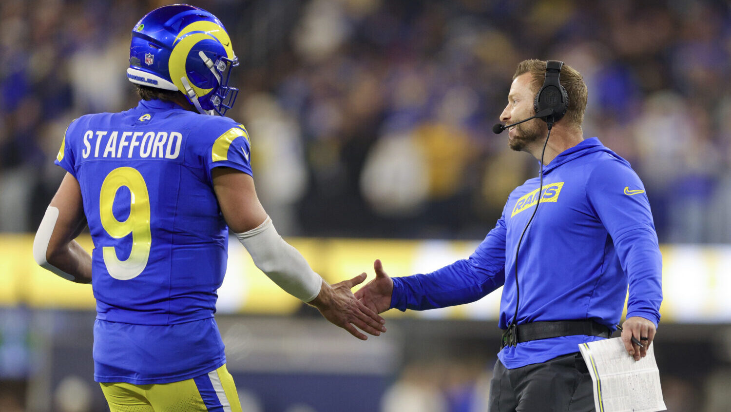 Los Angeles Rams quarterback Matthew Stafford (9) celebrates his team's rushing touchdown against t...