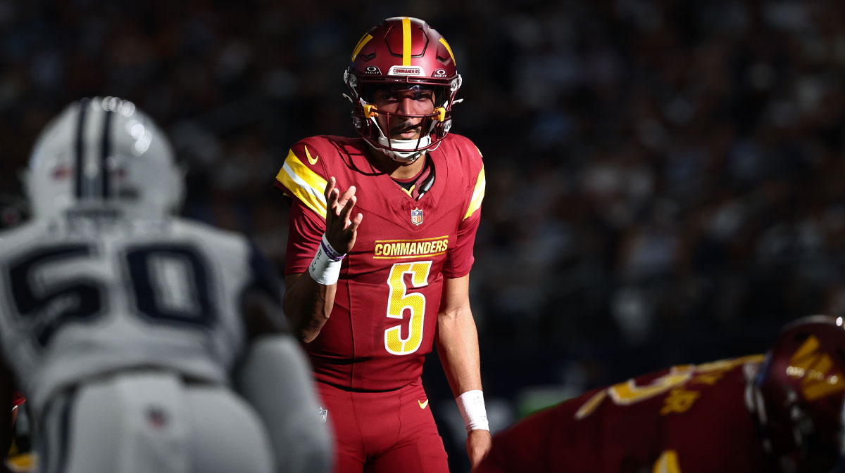 Washington Commanders quarterback Jayden Daniels (5) calls a play at the line of scrimmage against the Dallas Cowboys =d2q of the game at AT&T Stadium.