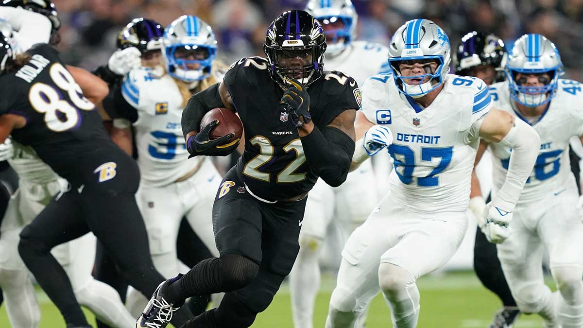 Baltimore Ravens running back Derrick Henry (22) rushes the ball against the Detroit Lions during the first half at M&T Bank Stadium.
