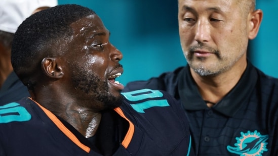 Tyreek Hill of the Miami Dolphins leaves the field following an injury.(Getty Images via AFP)