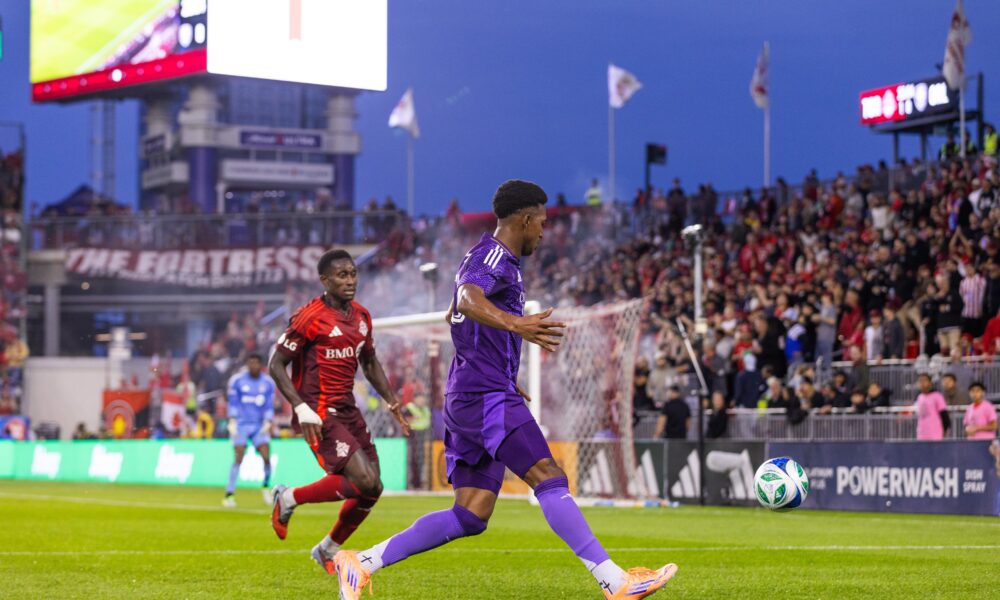 Image of Alex Freeman dribbling the ball up the flank against Toronto FC.