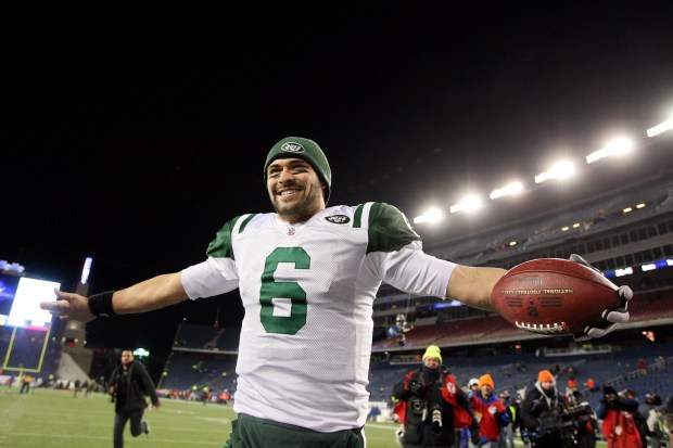 Mark Sanchez of the New York Jets celebrates after the Jets defeated the Patriots 28 to 21 in their 2011 AFC divisional playoff game at Gillette Stadium on January 16, 2011 in Foxboro, Massachusetts. (Photo by Al Bello/Getty Images)