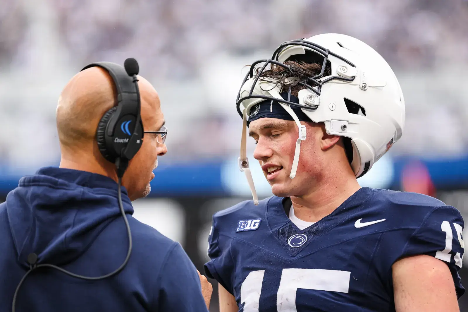 Head coach James Franklin of the Penn State Nittany Lions speaks with quarterback Drew Allar