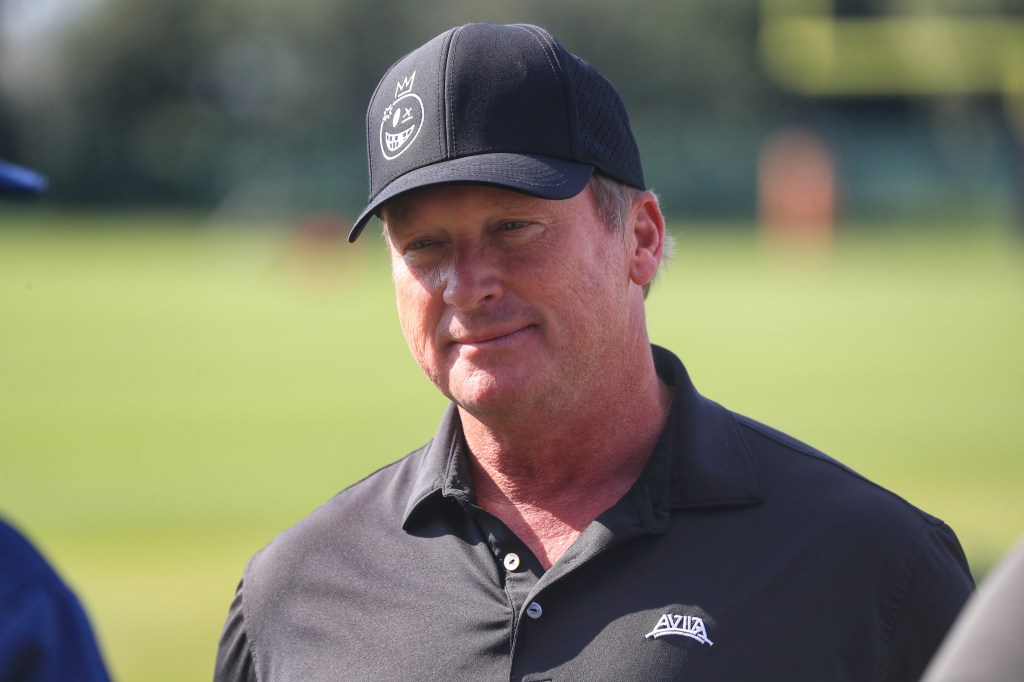 Former Tampa Bay Buccaneers Super Bowl winning Head Coach Jon Gruden visits with friends during the Titans - Buccaneers Joint Training Camp work out on August 7, 2025 at the AdventHealth Training Center at One Buccaneer Place in Tampa, Florida. 