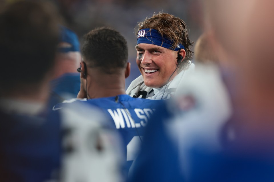 EAST RUTHERFORD, NEW JERSEY - AUGUST 21: Jaxson Dart #6 talks with Russell Wilson #3 of the New York Giants on the bench during the second quarter of an NFL Preseason 2025 game against the New England Patriots at MetLife Stadium on August 21, 2025 in East Rutherford, New Jersey. (Photo by Kathryn Riley/Getty Images)