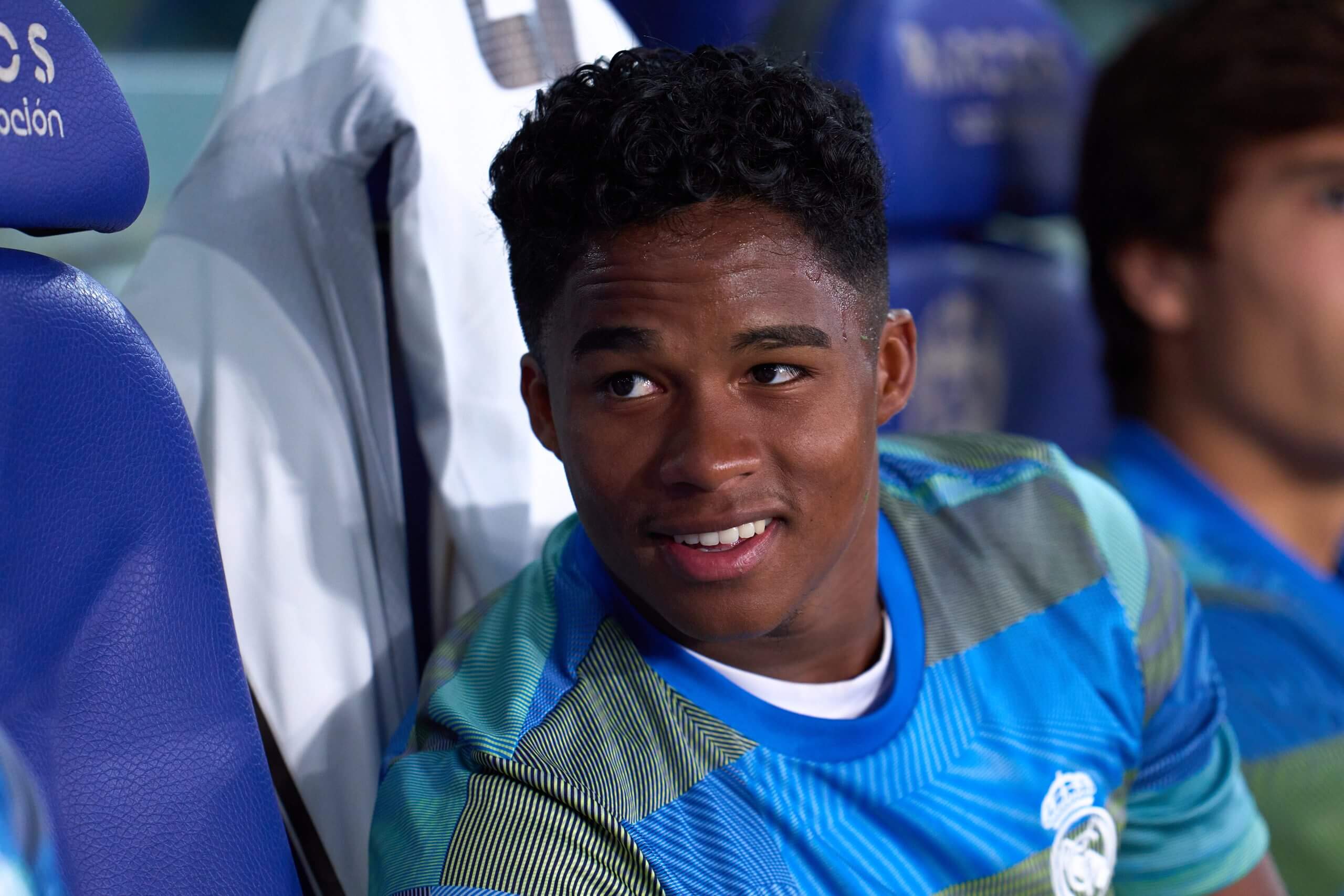 Real Madrid forward Endrick sits on the bench