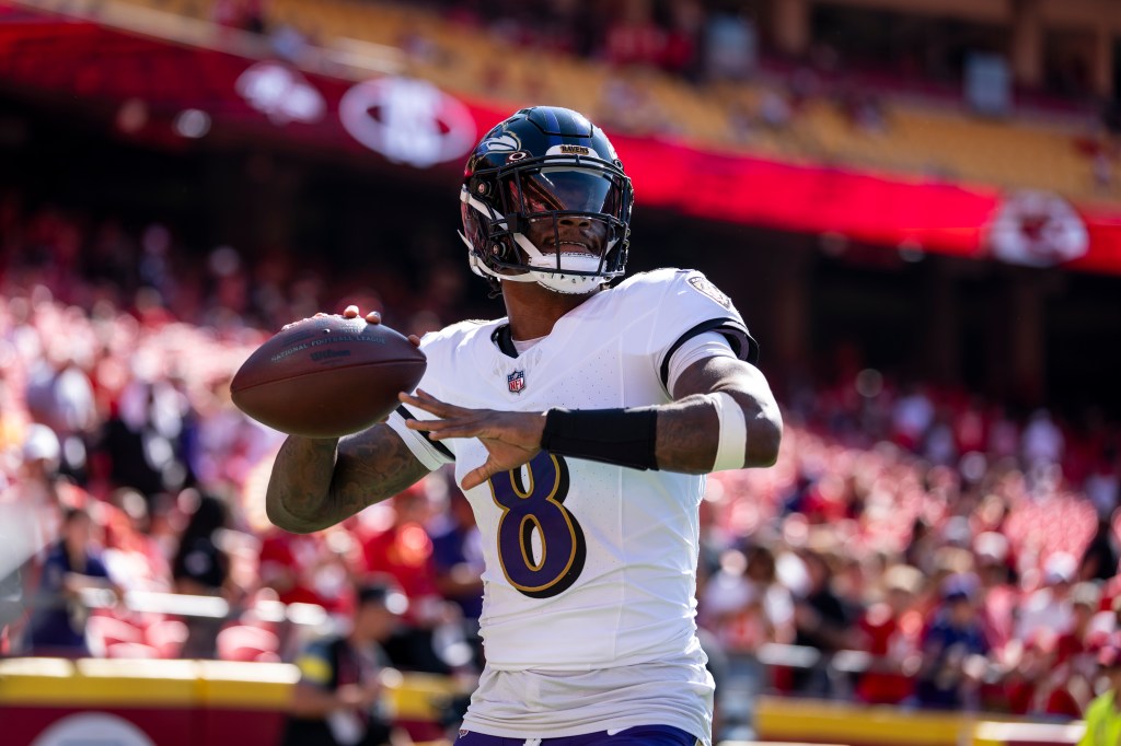 Lamar Jackson looks to pass prior to an NFL football game against the Kansas City Chiefs at Arrowhead Stadium on September 28, 2025.