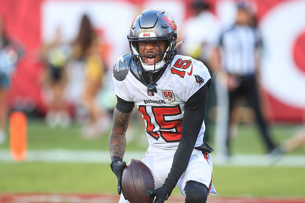 TAMPA, FL - OCTOBER 12: Tampa Bay Buccaneers Wide Receiver Tez Johnson (15) catches a touchdown pass and celebrates in the end zone during the Regular Season game between the San Francisco 49ers and the Tampa Bay Buccaneers on October 12, 2025 at Raymond James Stadium in Tampa, Florida. (Photo by Cliff Welch/Icon Sportswire via Getty Images)