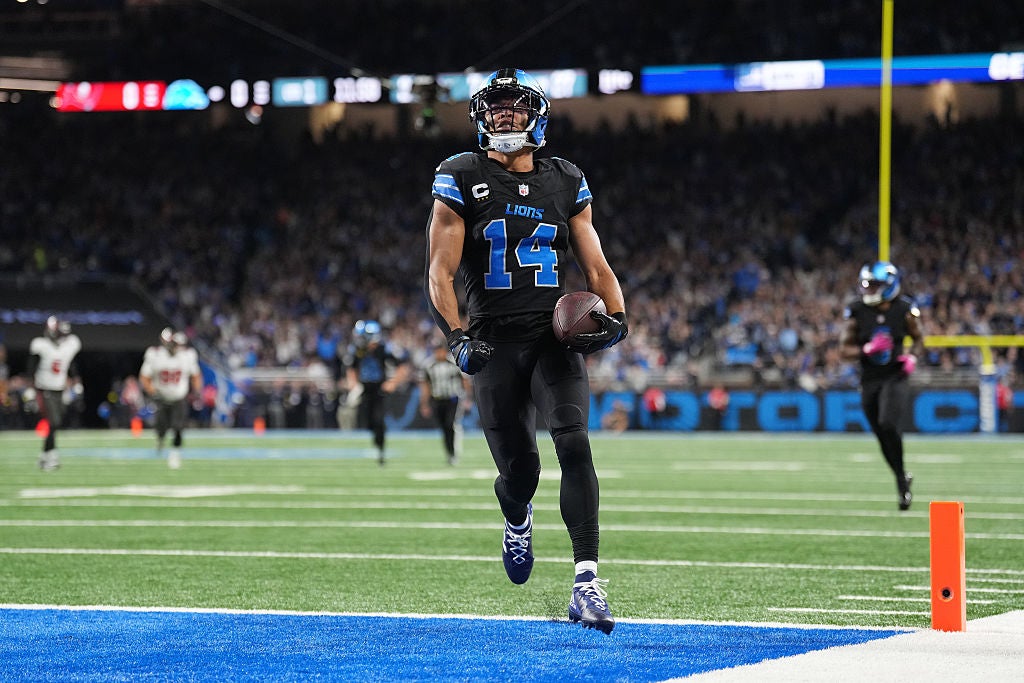 Amon-Ra St. Brown #14 of the Detroit Lions celebrates after scoring a touchdown during a game against the Tampa Bay Buccaneers. (Nic Antaya/Getty Images)