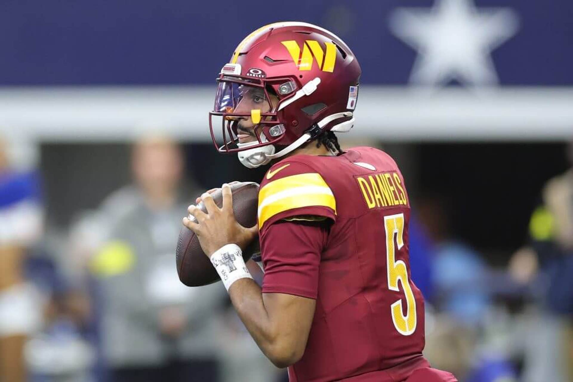 Washington quarterback Jayden Daniels looks to pass during a game against the Dallas Cowboys