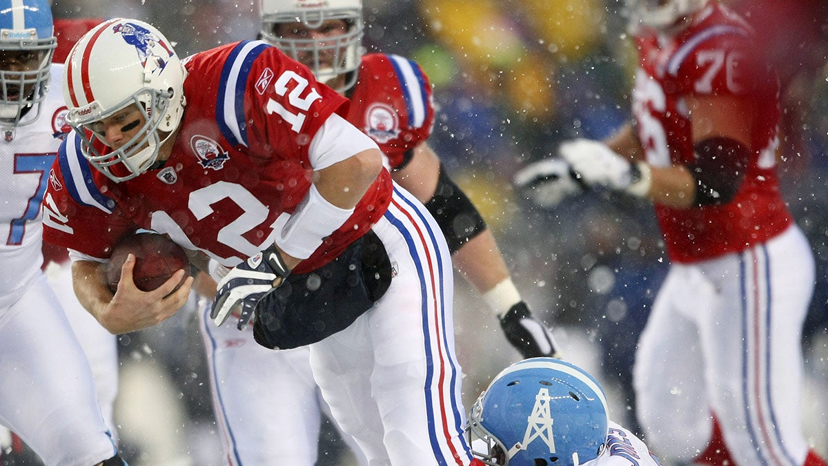 Tom Brady #12 of the New England Patriots is sacked by Jason Jones #91 of the Tennessee Titans on Oct. 18, 2009 at Gillette Stadium. (Elsa/Getty Images)