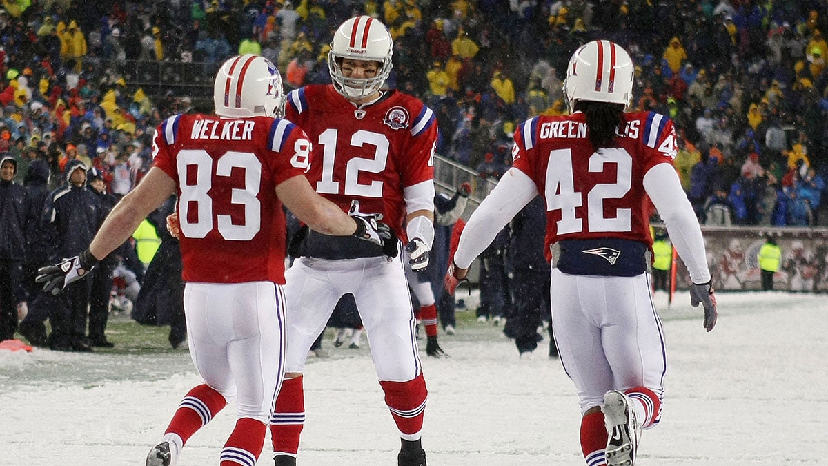 Tom Brady #12 of the New England Patriots congratulates Wes Welker #83 after a touchdown against the Tennessee Titans on Oct. 18, 2009 at Gillette Stadium. (Elsa/Getty Images)
