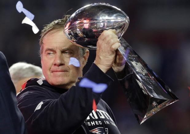FILE - New England Patriots head coach Bill Belichick holds up the Vince Lombardi Trophy as he celebrates after the Patriots defeated the Seattle Seahawks 28-24 in NFL Super Bowl XLIX football game Sunday, Feb. 1, 2015, in Glendale, Ariz. (AP Photo/Patrick Semansky, File)