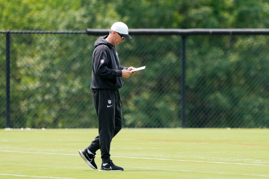 Baltimore Ravens offensive coordinator Todd Monken checks his notes during the team’s organized team activities at the Under Armour Performance Center in Owings Mills, Md. on Tuesday, June 3, 2025.