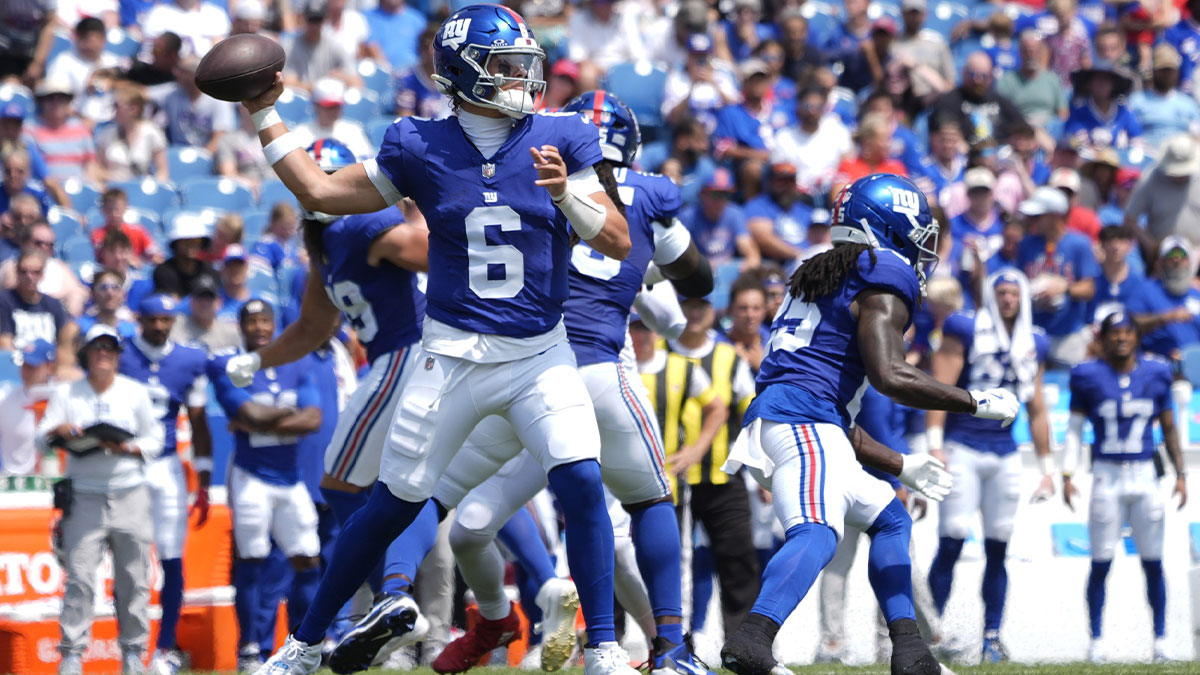 New York Giants quarterback Jaxon Dart (6) throws the ball during the first half at Highmark Stadium. 