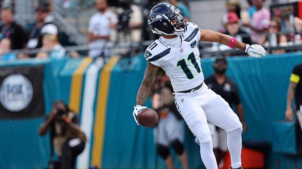 Seattle Seahawks wide receiver Jaxon Smith-Njigba (11) celebrates after a touchdown during the first half against the Jacksonville Jaguars at EverBank Stadium. 