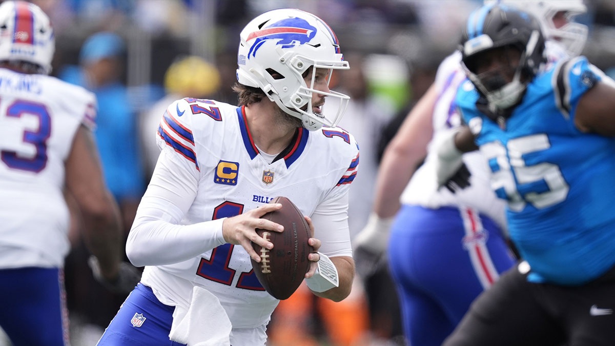 Buffalo Bills quarterback Josh Allen (17) drops to throw during the first half against the Carolina Panthers at Bank of America Stadium.
