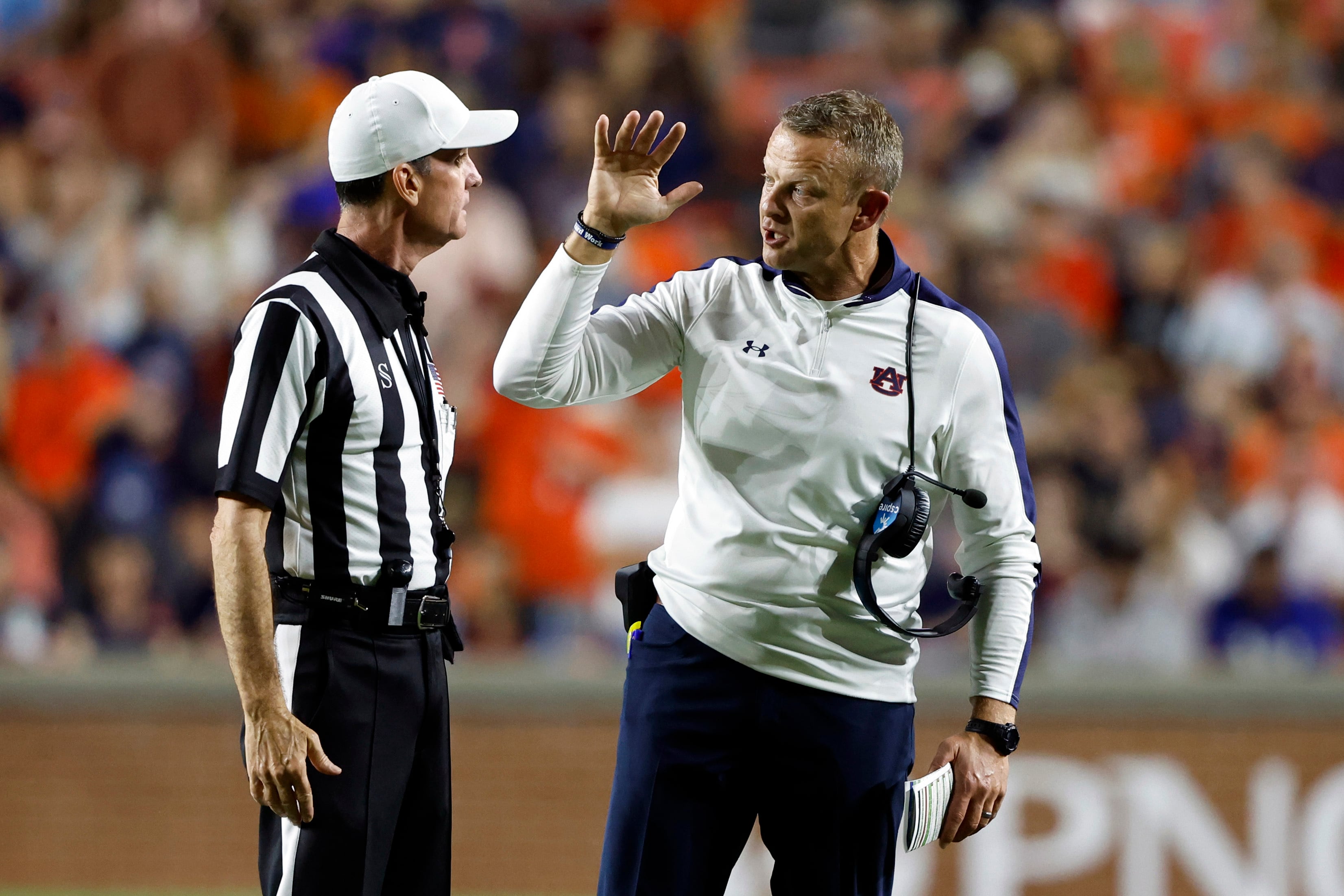 Auburn head coach Bryan Harsin talks with the referee Ken Williamson during the second half of...