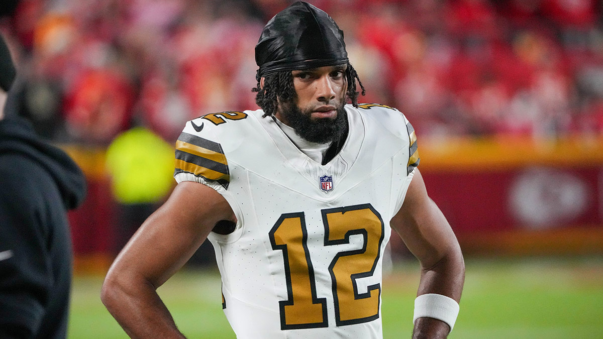 New Orleans Saints wide receiver Chris Olave (12) on the sidelines against the Kansas City Chiefs during the game at GEHA Field at Arrowhead Stadium.