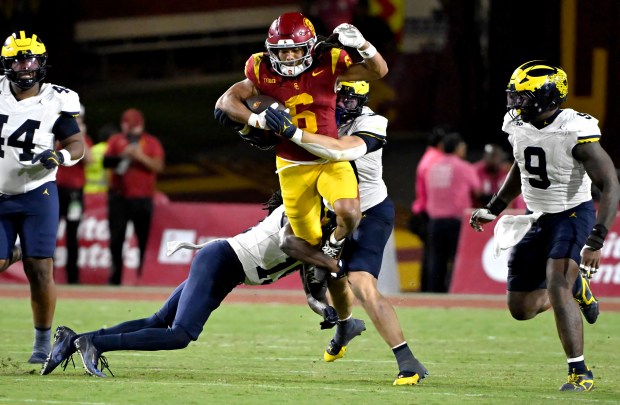Wide receiver Makai Lemon #6 of the USC Trojans leaps...