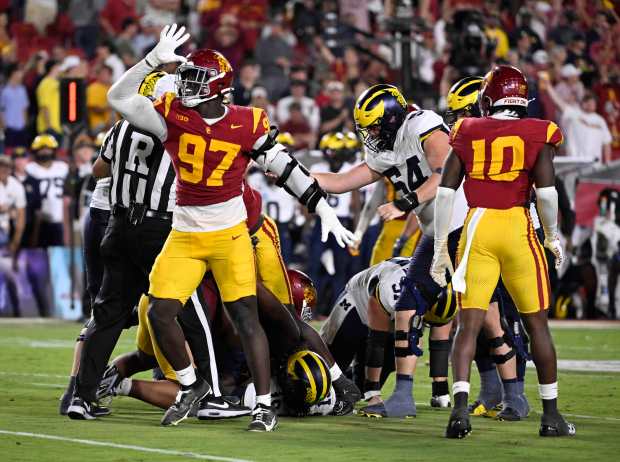Defensive tackle Jide Abasiri #97 of the USC Trojans reacts...