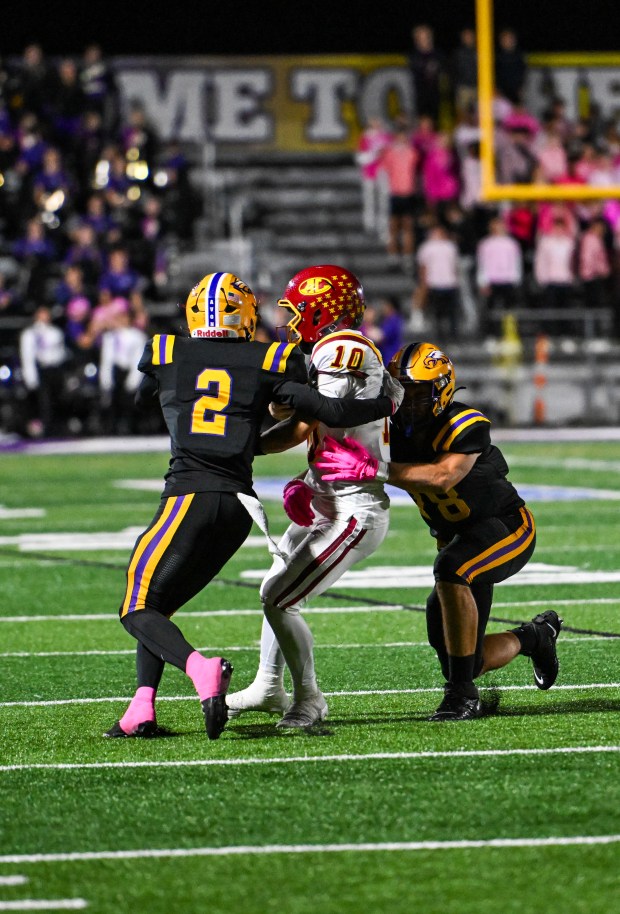 Avon defenders converge on Avon Lake quarterback Dawson Tenbrink on Oct. 17. (Shane Pabon - for The Morning Journal)