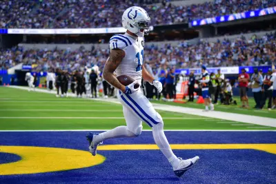 Sep 28, 2025; Inglewood, California, USA; Indianapolis Colts wide receiver Michael Pittman (11) scores a touchdown against the Los Angeles Rams during the second half at SoFi Stadium. 