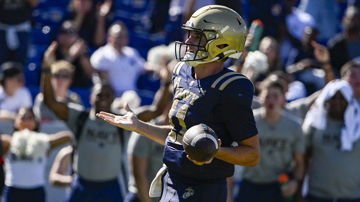 Navy Midshipmen quarterback Blake Horvath (11) reacts after scoring a touchdown during the second half against the Air Force Falcons at Navy-Marine Corps Memorial Stadium. 