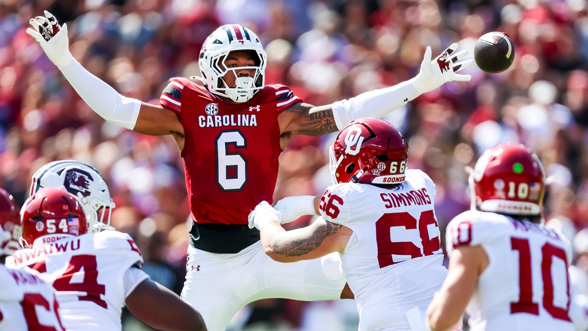 South Carolina Gamecocks defensive end Dylan Stewart (6) attempt to knock down a pass by Oklahoma Sooners quarterback John Mateer (10) in the first quarter at Williams-Brice Stadium.