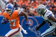 Denver Broncos running back J.K. Dobbins (27) gets past Dallas Cowboys cornerback Daron...