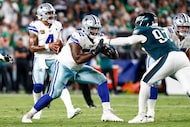 Dallas Cowboys guard Tyler Booker (52) blocks Philadelphia Eagles defensive tackle Moro...