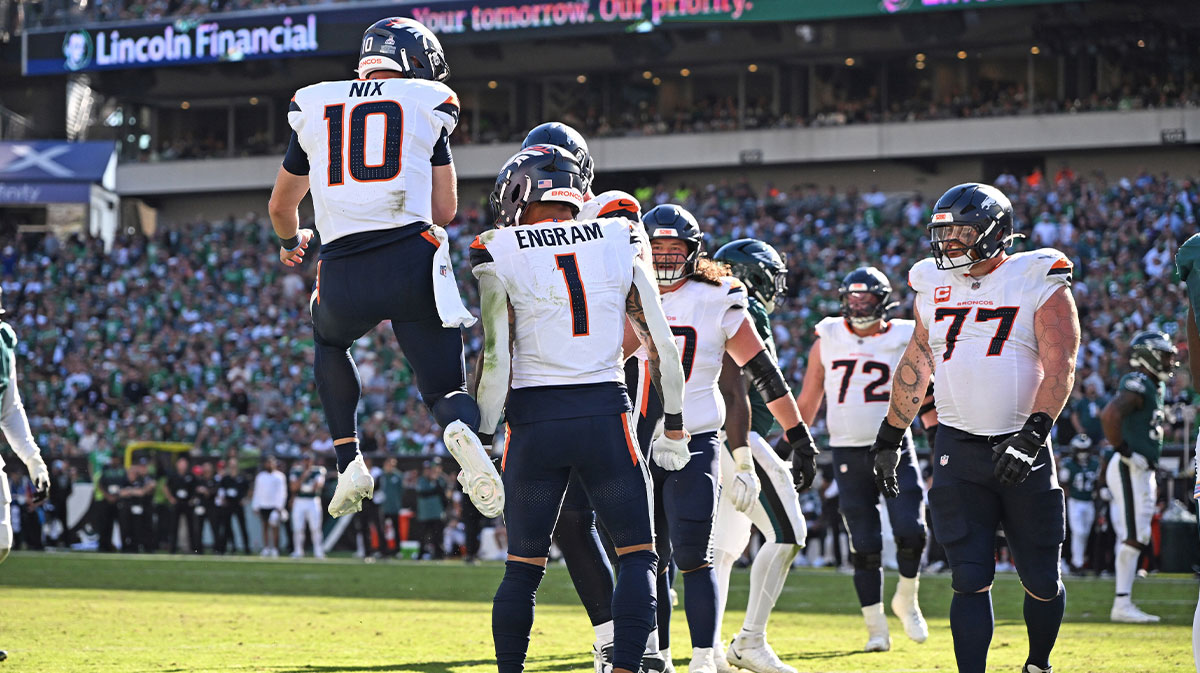 Denver Broncos quarterback Bo Nix (10) and Denver Broncos tight end Evan Engram (1) celebrate touchdown during the fourth quarter against the Philadelphia Eagles at Lincoln Financial Field.