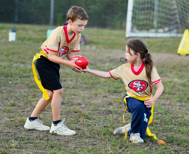 Vivienne Ward snaps the ball to Nick Bublavi. (Photo by...
