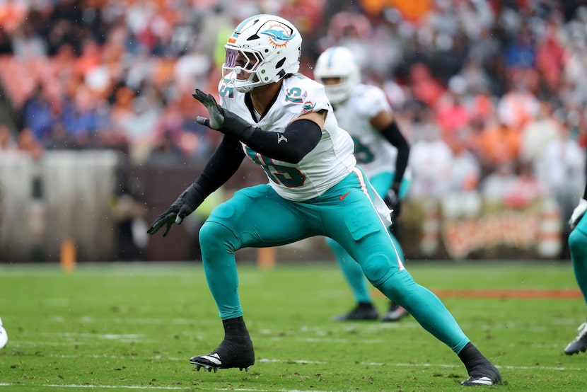 Miami Dolphins linebacker Jaelan Phillips (15) runs after the ball during an NFL football...