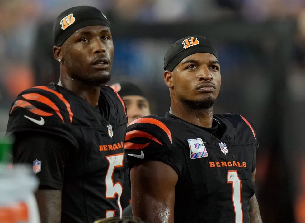Cincinnati Bengals wide receiver Tee Higgins (5) and wide receiver Ja'Marr Chase (1) watch the...
