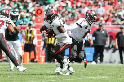Sep 28, 2025; Tampa, Florida, USA; Tampa Bay Buccaneers running back Rachaad White (1) receives a hand off by quarterback Baker Mayfield (6) during the second quarter against the Philadelphia Eagles at Raymond James Stadium. 