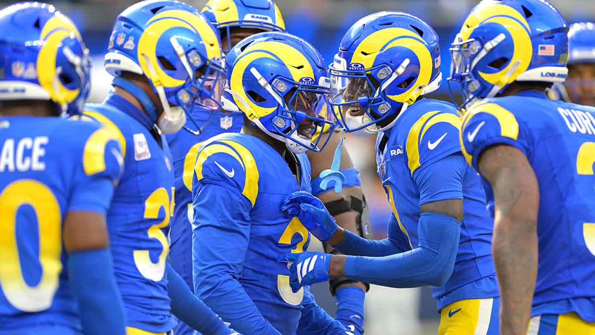 Los Angeles Rams safety Kam Curl (3) is congratulated after an interception in the fourth quarter against the Indianapolis Colts at SoFi Stadium.