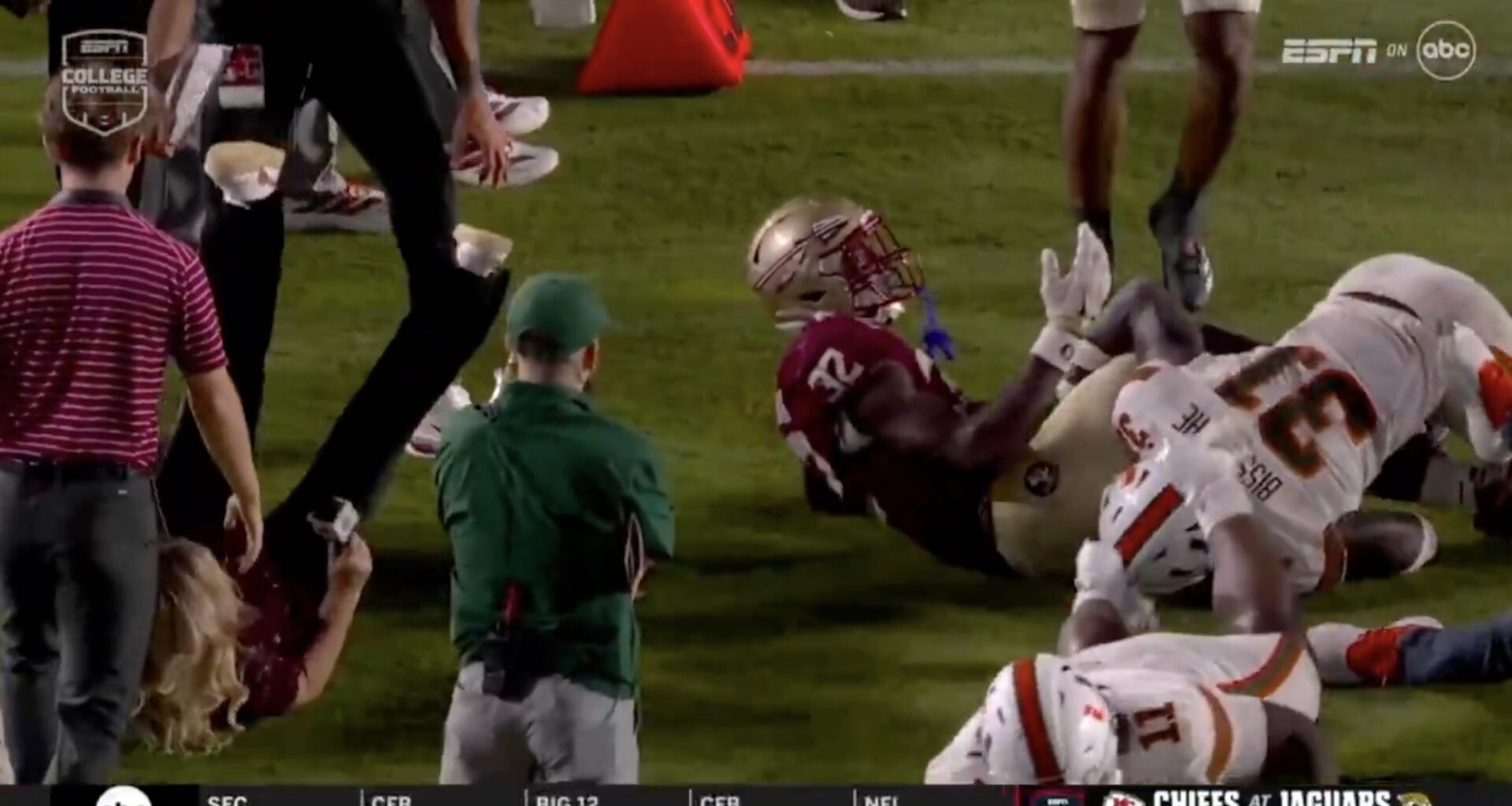 Holly Rowe takes sideline hit, immediately pops up to report on it