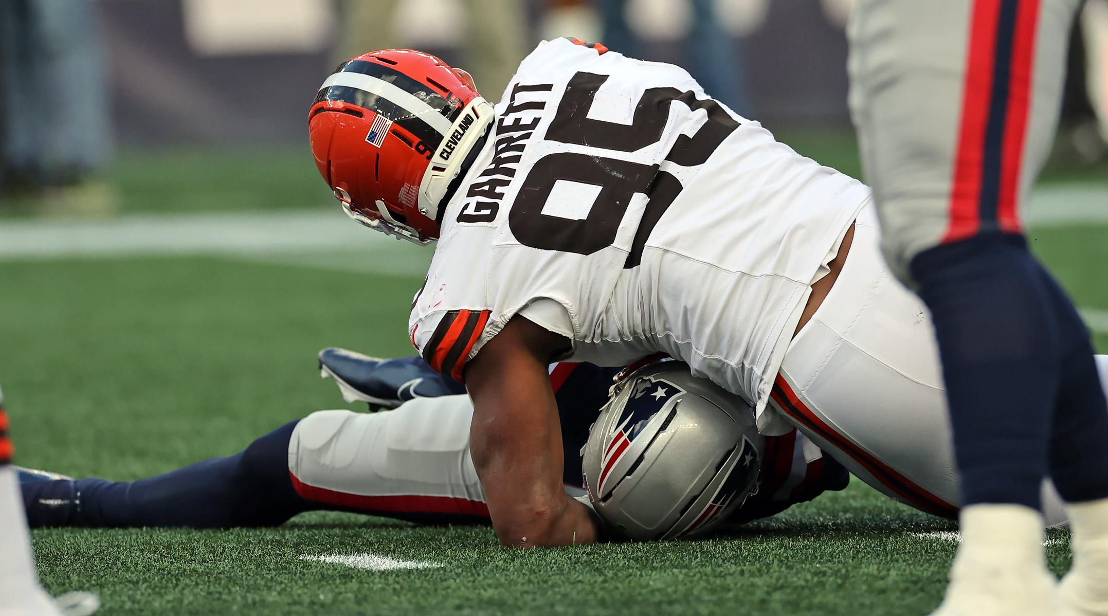 Cleveland Browns defensive end Myles Garrett sacks New England Patriots quarterback Drake Maye in the second half of play. 